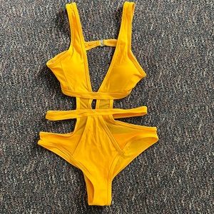 Brand new one cut out one piece swim suit!